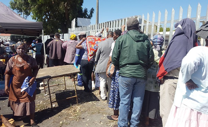 Photo of social grant recipients queuing
