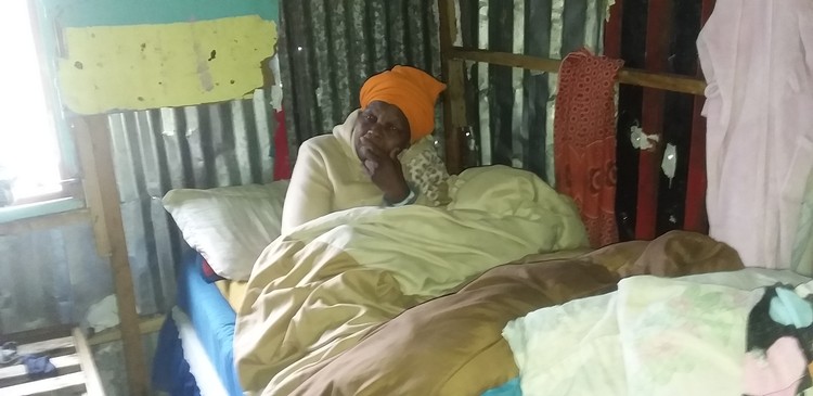 Sweetness Nzinge was stuck on her bed in Qaduqadu informal settlement in Khayelitsha after severe flooding in the area on Monday and Tuesday. Photo: Nombulelo Damba-Hendrik