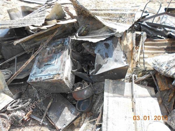 Ruins of Ntombi's microwave and fridge. Photo by Faizel Slamang.