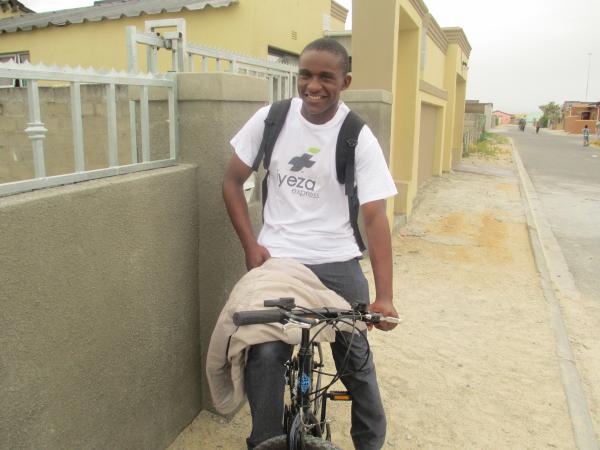 Sizwe Nzima on his delivery bike. Photo by Mihle Pike.