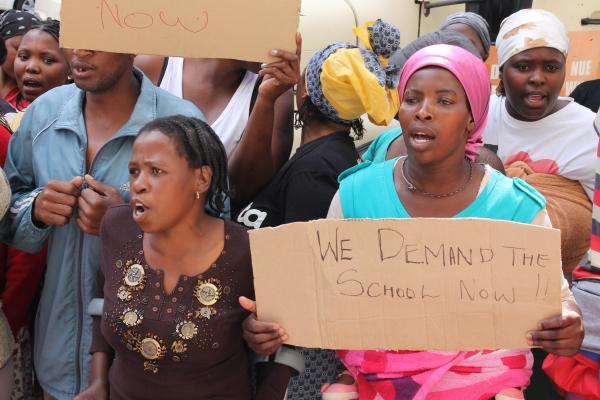 Parents protesting outside the legislative building in Wale Street demanding a new school. Photo by Mihle Pike.