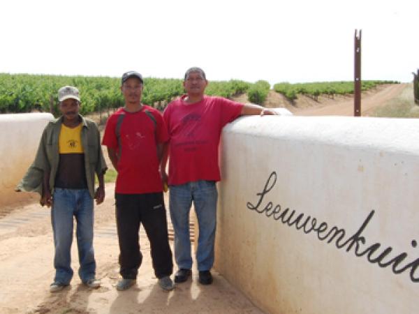 Former farm workers Amos White and Johan Carstens and CSAAWU General Secretary Karel Swart. Photo by Tessa Gooding.