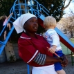 GroundUp archive image of a domestic worker with her employer’s child. Photo by Masixole Feni. GroundUp archive image of a domestic worker with her employer’s child. Photo by Masixole Feni.