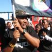 Funeka Soldaat waves a flag at Nyanga's first gay pride march. Photo by Nyameka Nkosana. Funeka Soldaat waves a flag at Nyanga's first gay pride march. Photo by Nyameka Nkosana.