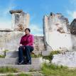 Margaret Constant sits on the steps of one of the ruined houses of her childhood. Photo by Masixole Feni. Margaret Constant sits on the steps of one of the ruined houses of her childhood. Photo by Masixole Feni.