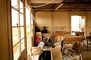 A photo of a dilapidated classroom in a school