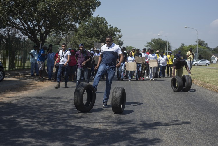 Photo of protesters, some with tyres