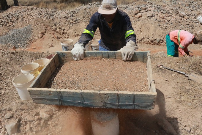 Photo of men looking for diamonds