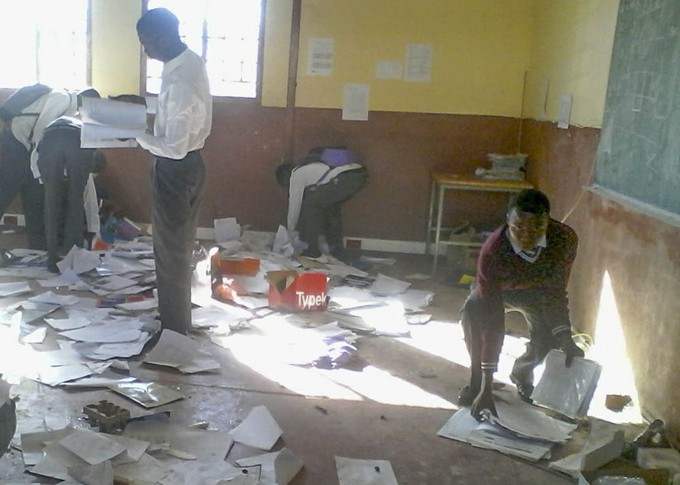 Photo of students cleaning up a classroom after protests