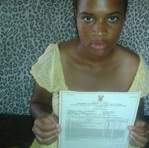 Photo of girl with matric certificate