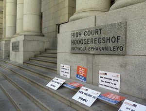 Photo of placards outside the Western Cape High Court