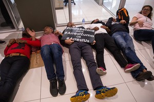 Photo of several people lying on the floor