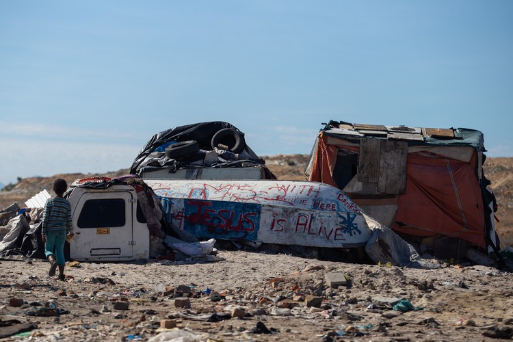 Photo of an upturned boat and bakkie canopies