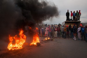 Roads were blocked with burning tires and debris early in the morning inside Grabouw. Some residence who were watching were not sure why the the protest was happening or who the leaders were.