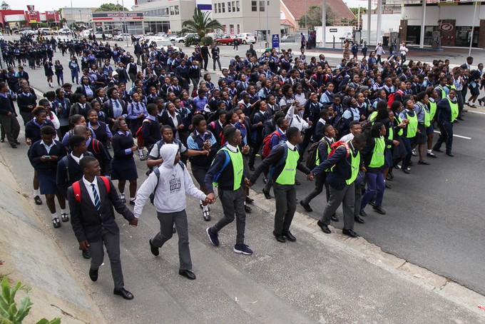 Photo of high school students marching