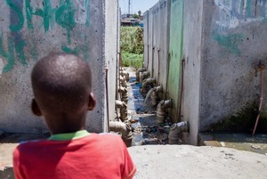 Photo of toilets and a child