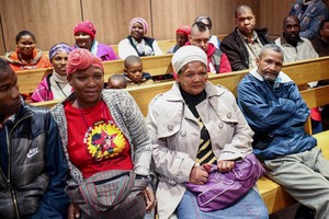 Photo of people sitting in court