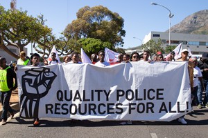 Photo of marchers with banner