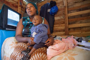 Photo of mother and child in shack