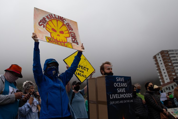 Hundreds of people protest in Muizenberg against Shell’s planned seismic survey to explore oil and gas deposits off the Eastern Cape’s Wild Coast. - Ashraf Hendricks