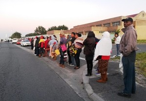 Photo of people in queue for social grants