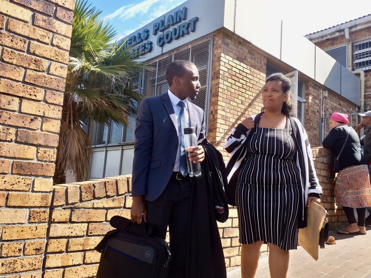 Photo of two people outside court