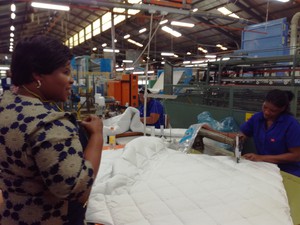 Photo of two women in a factory
