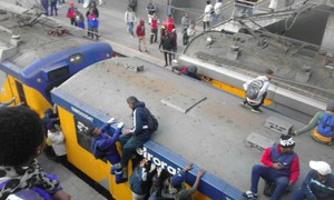 Photo of people on top of train