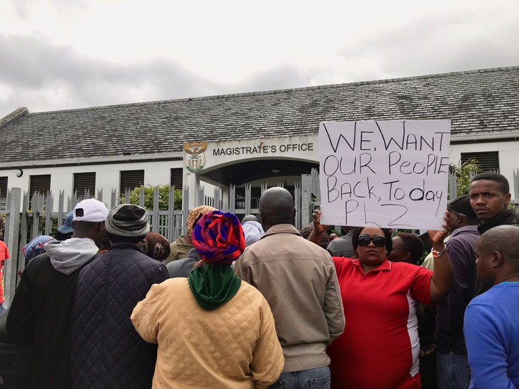 Photo of people outside court