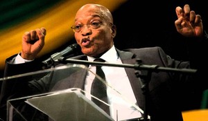 Photo of Zuma in large meeting hall with investors