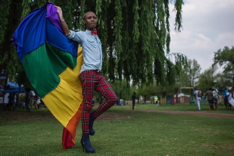 Photo of a man with a rainbow flag