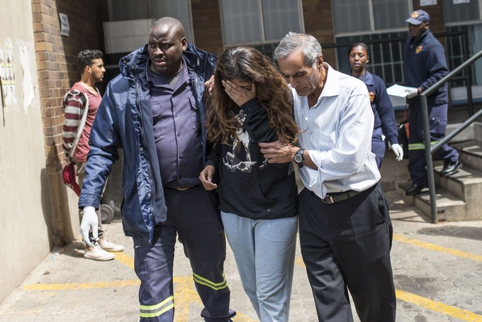 Photo of Shaeera Kalla, her father and a paramedic