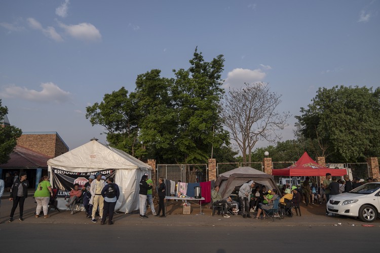 Protesters camp outside Soweto police station after a surge in gun ...