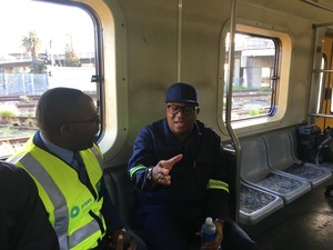 Photo of two men on a train