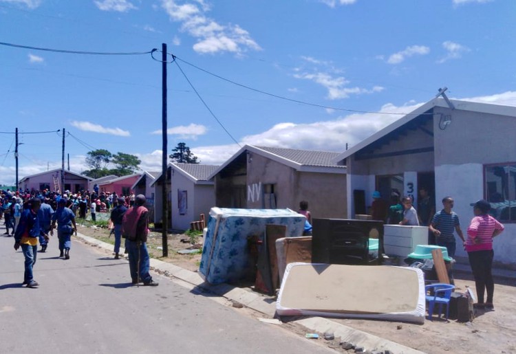Photo of a street with evictions taking place