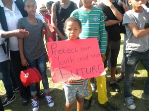 Photo of boy with placard