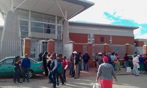 Photo of people outside a court building