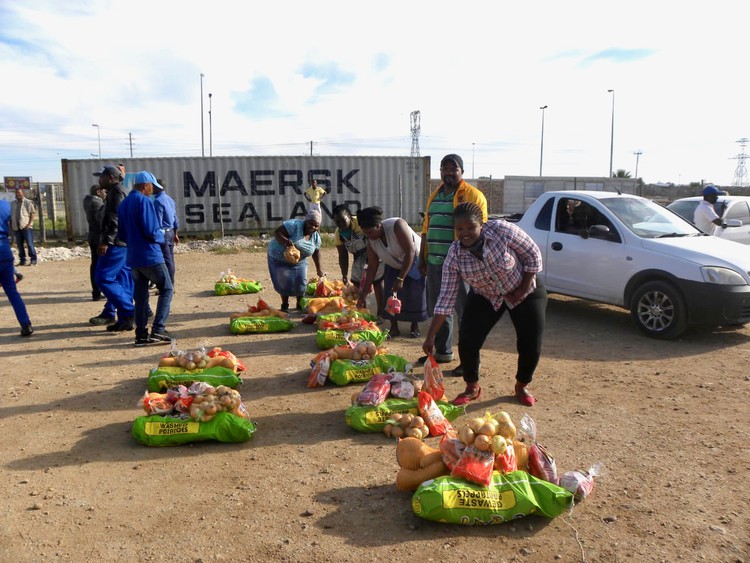 Photo of people collecting food parcels