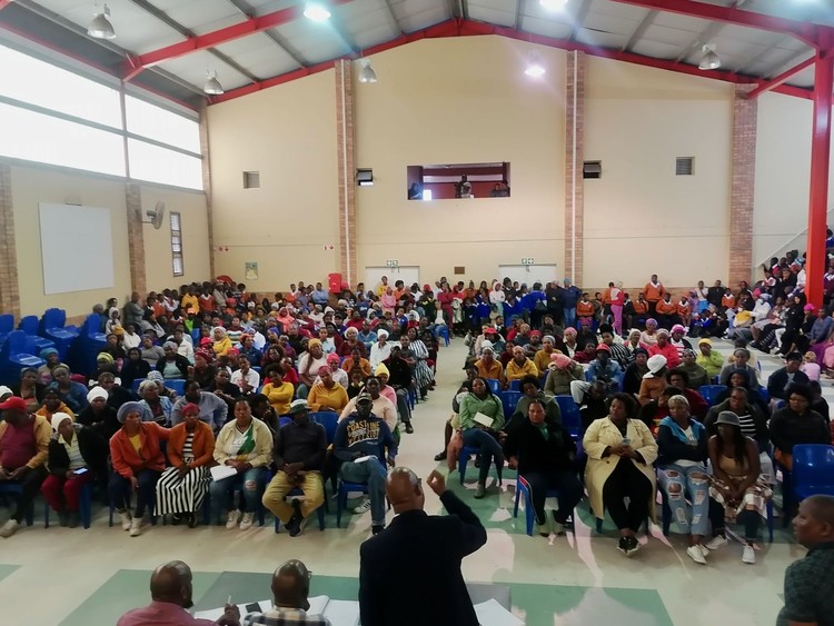 Photo of a community meeting in a hall