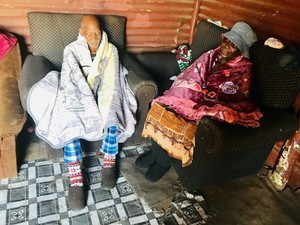Photo of two fold people with blankets