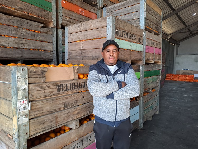 Albert Klaase grows citrus and other vegetables on a section of Proefplaas. He also uses this big storeroom on the property, which he says he fixed up with his own money.