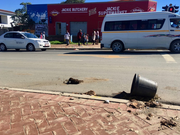 Photo of a street with a bucket