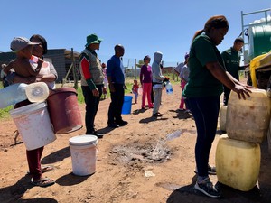 Photo of a people collecting water