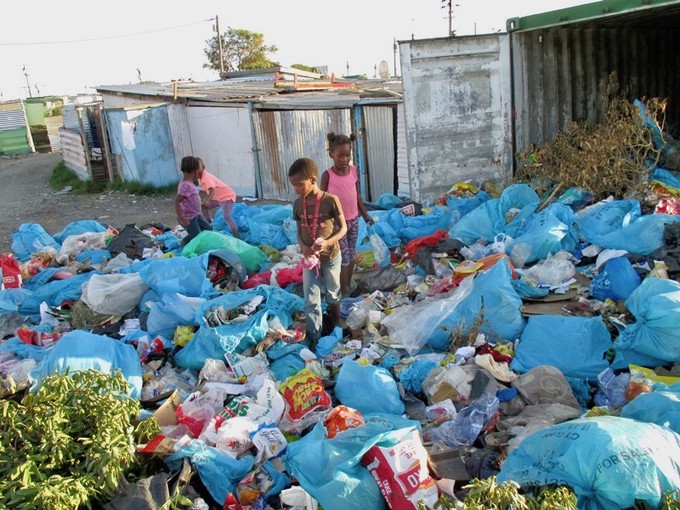 Photo of children playing in rubbish tip