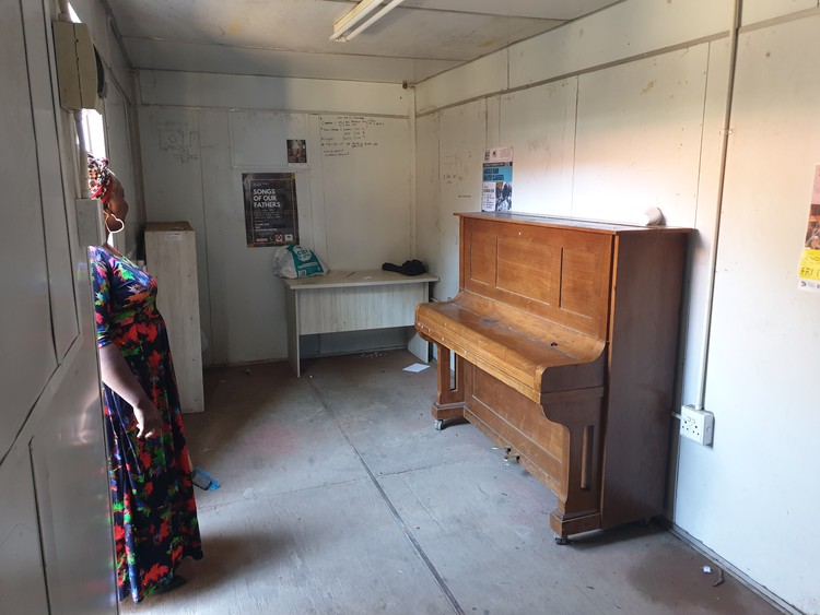 Photo of piano in container