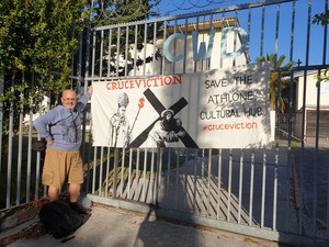Photo of man in front of gate
