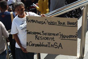 Photo of woman holding placard