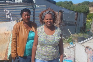 Photo of two women in informal settlement