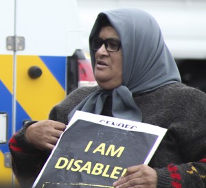 Photo of woman in wheelchair at protest 