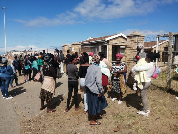 Photo of people standing outside the clinic